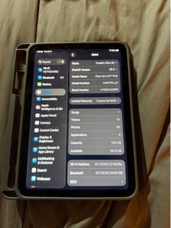 iPad Mini A17 Pro tablet with charger and case