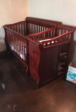 Solid wooden crib with attached changing table