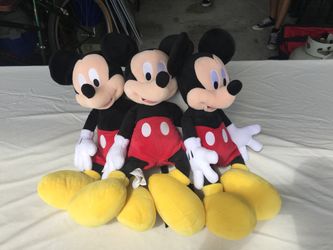 Three Mickey Mouse plushy