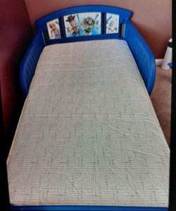 Like new toy story  toddler bed with mattress .