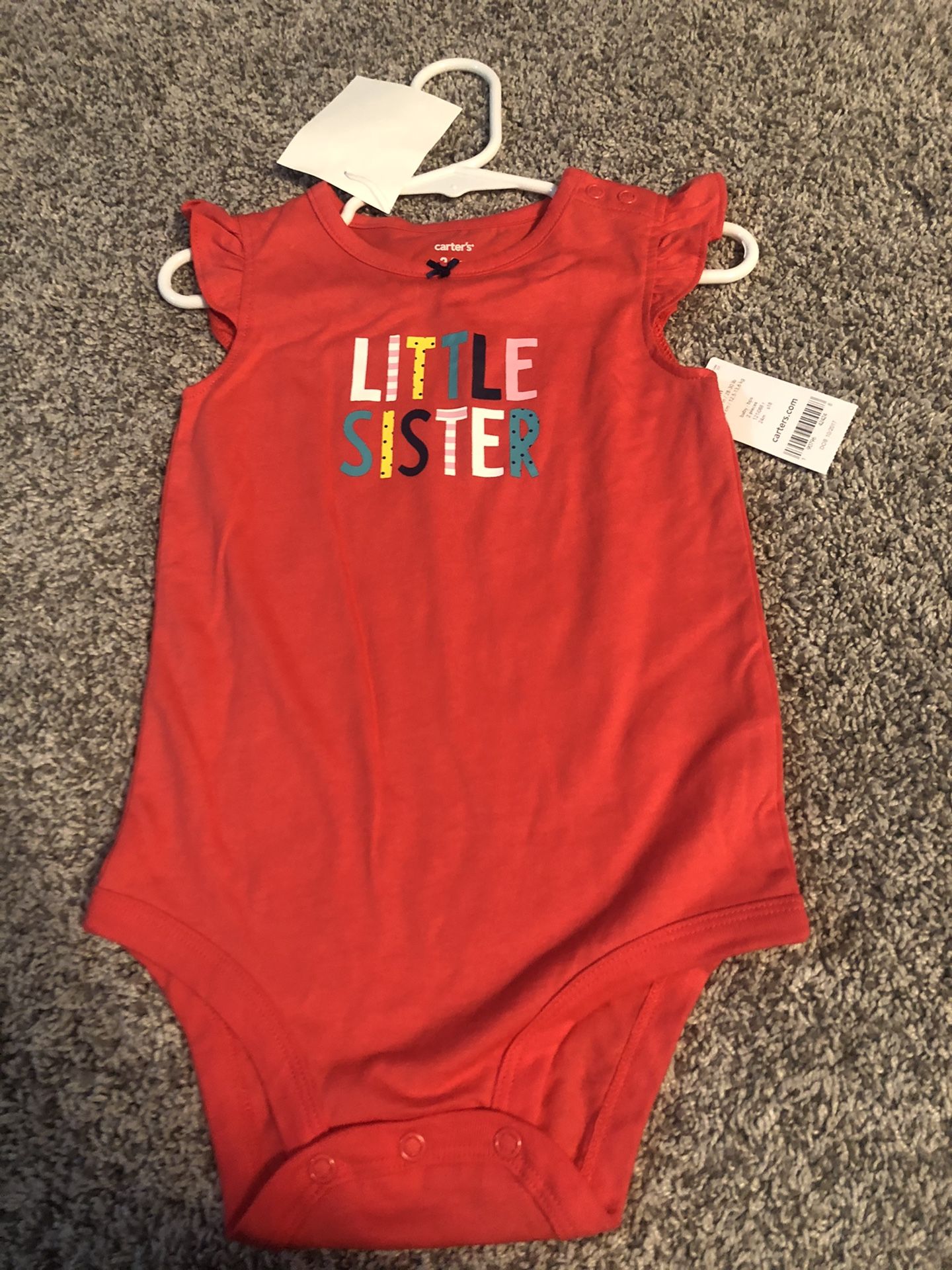 Carter’s brand size 12 month brand new onesie that was never worn