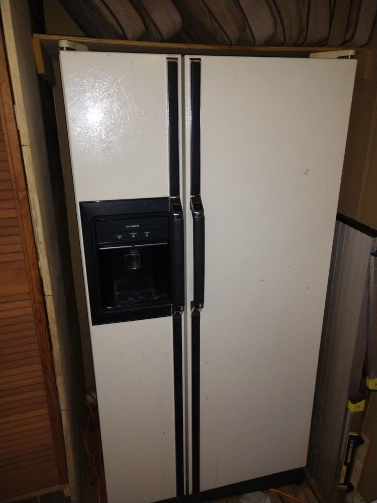 Kenmore side-by-side refrigerator with water dispenser