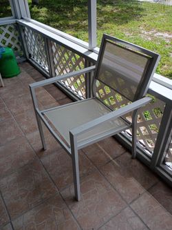 Two white patio chairs