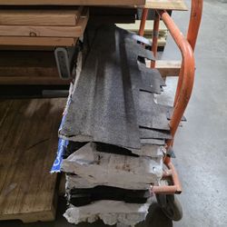 LEFT OVER ROOF SHINGLES APPROXIMATELY  4-5  PACKS 