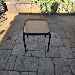 Patio table with glass top