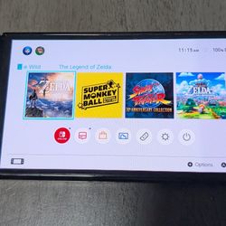 OLED Nintendo Switch With Games And Controllers
