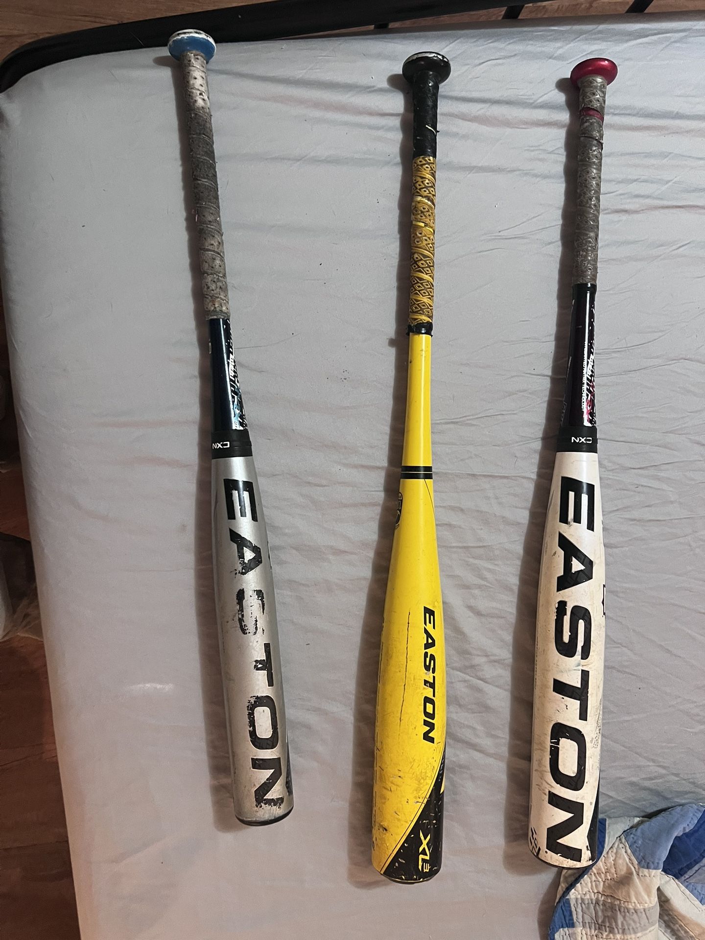 White Easton is a 31 -10. Yellow Easton is a 31 -9 Gray Easton is a 29 -12
