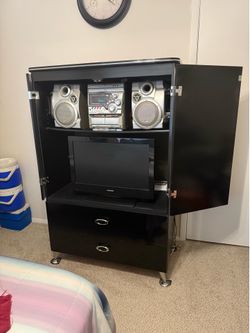 Black glossy armoire by Ashley