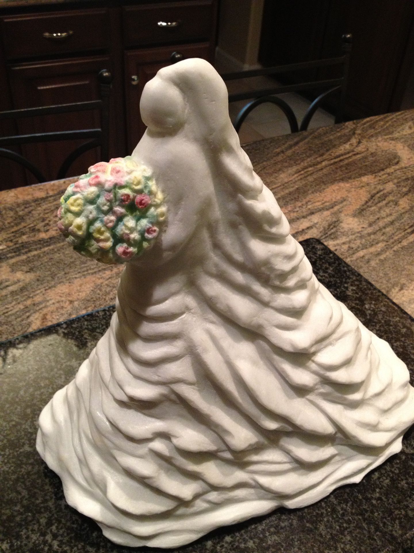 Bride From Carrara Marble sculpture holding sculpted roses 