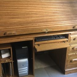 Brown wooden roll top desk