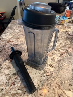 Vitamix container with plunger.