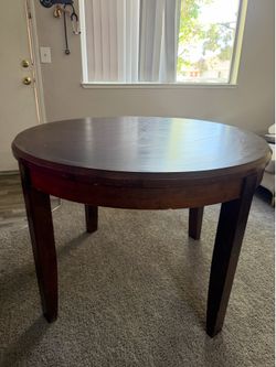 Round Dark Wood Dining Table