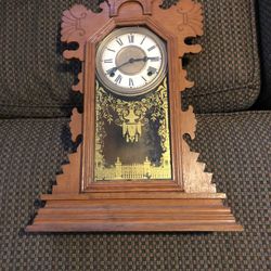 Beautiful old clock has key in pendulum.