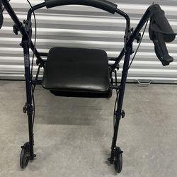 Carex medical walker with seat. Used in good condition with some cosmetic blemishes like scratches and scuff marks from prior usage. There is a small 