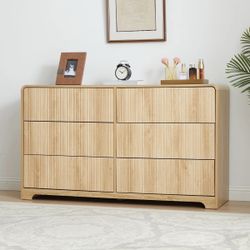 This sleek 6-drawer double dresser features a minimalist design with press-bounce drawers for a clean, modern look. The elegant curved top plate not o