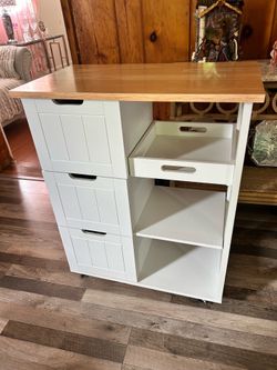 kitchen island cart with a wooden countertop