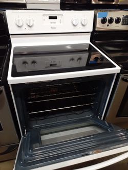 Whirlpool glass top electric stove working perfectly with 4 months warranty