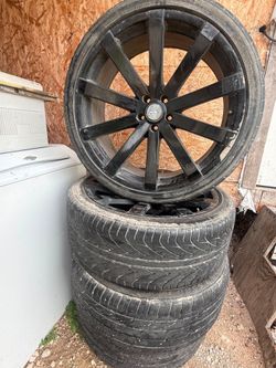 Black rims with the 4 tires 26535R22