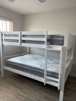 Full over Full bunk bed. Dark walnut,grey & white-$499. Full mattresses -$125.00 each. Assembly not included. Taxes included. Free delivery.  Se habla