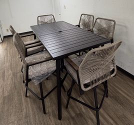 7-Piece Metal Bar Height Outdoor Dining Set with Rectangle Table and Swivel Bar Stools with Beige Cushions