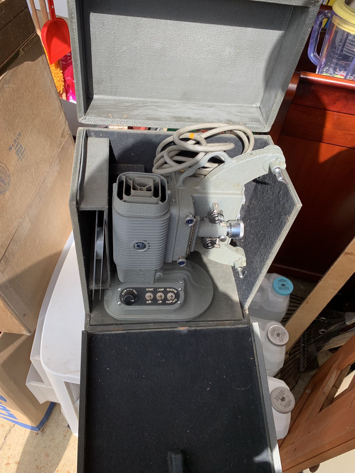 Vintage projector and screen with splicer