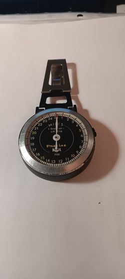 Vintage analog pedometer.
