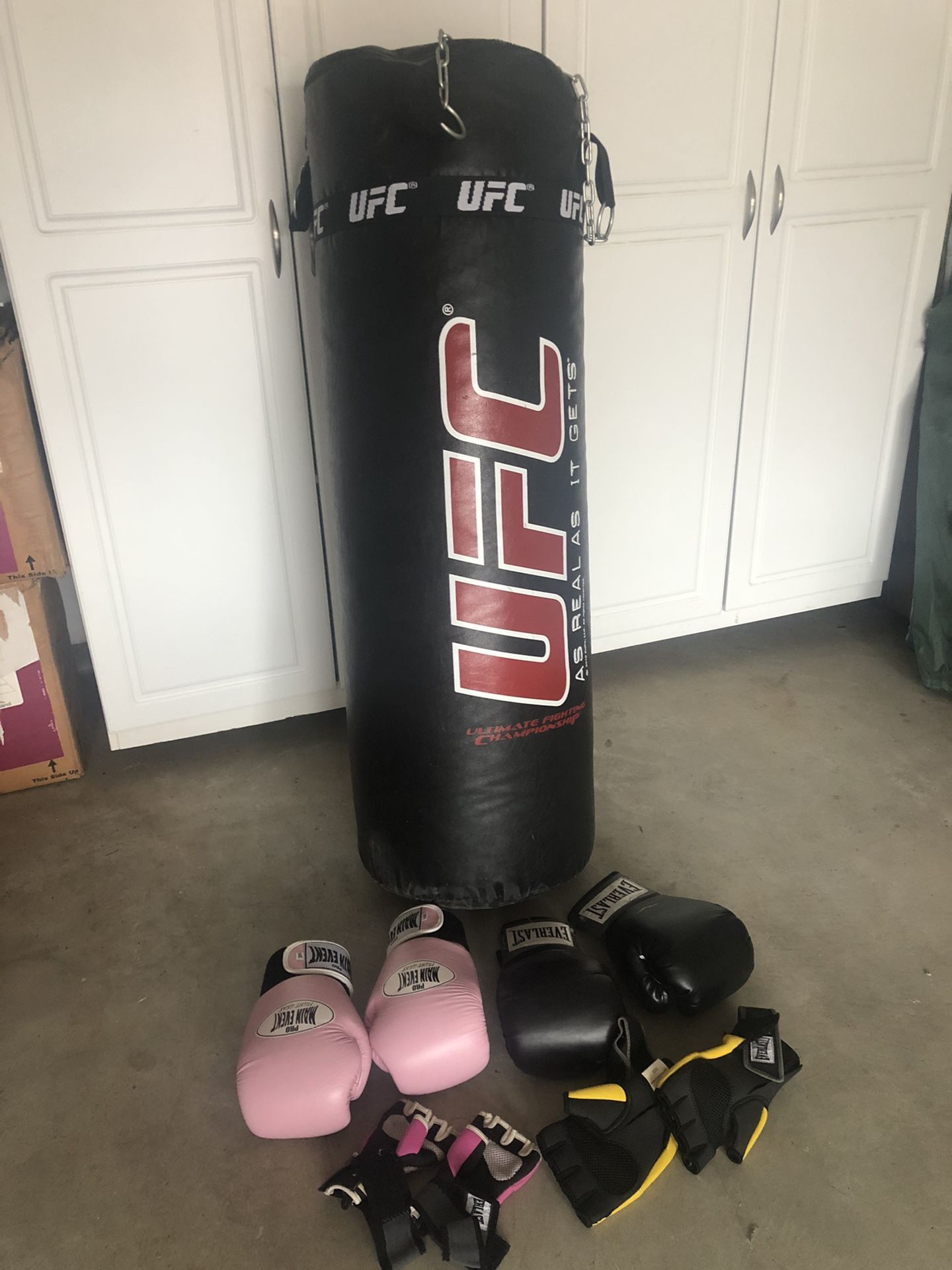 UFC heavy punching bag with male & female gloves