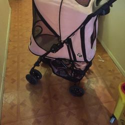 Pink pet stroller