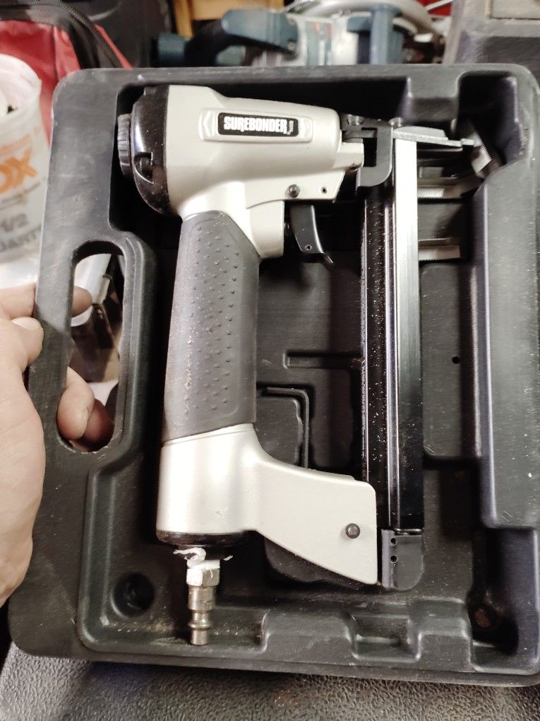 Pneumatic staple gun.