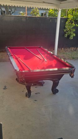 Pool Table with Red Felt and Carved Wood Frame