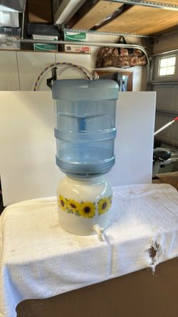 Watercraft dispenser, sunflower design, and 5 gallon water bottle