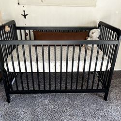 Black wooden baby crib