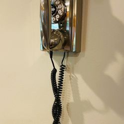 Crosley,Wall Phone, in a brushed chrome finish.
