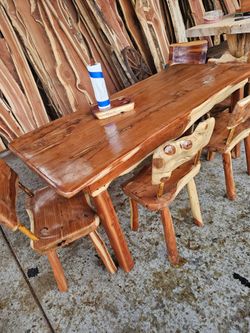 Table and chairs and More material with fruit holder and paper towl and More material