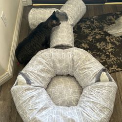 cat tunnel and bed set featuring a patterned fabric.