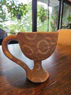 Decorative clay cup