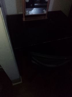 Work desk and office chair and a vanity light to do makeup for homework or paperwork for work