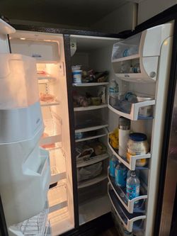 Priced for quick sale  Whirlpool Gold "Conquest" Series Side-by-Side Refrigerator
