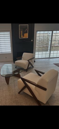 2 mid century custom white accent chairs from living spaces.