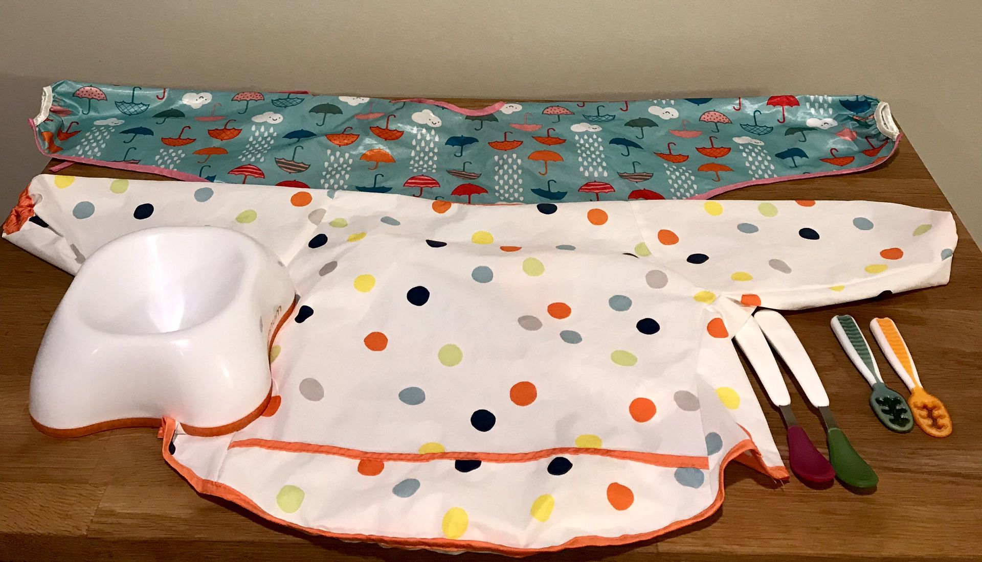 Baby sleeved bibs , cereal bowl,and spoons
