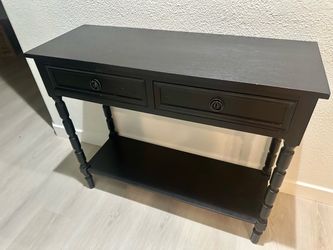 Black two-drawer console table with a lower storage shelf . Not heavy Originally cost $199