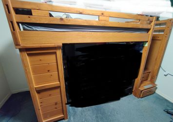 Twin lofted bed with stairs and dresser