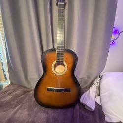 cherry wood guitar goes for $140