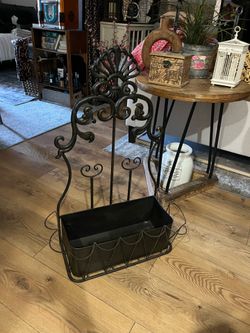 Black wrought iron beautiful planter or storage shelf 29” tall