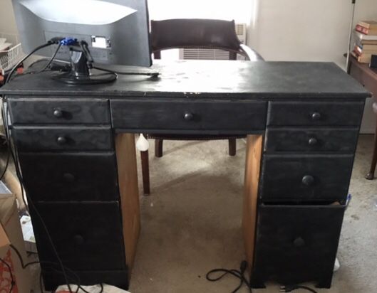 Black wooden student knee hole desk