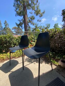 2 modern black chairs