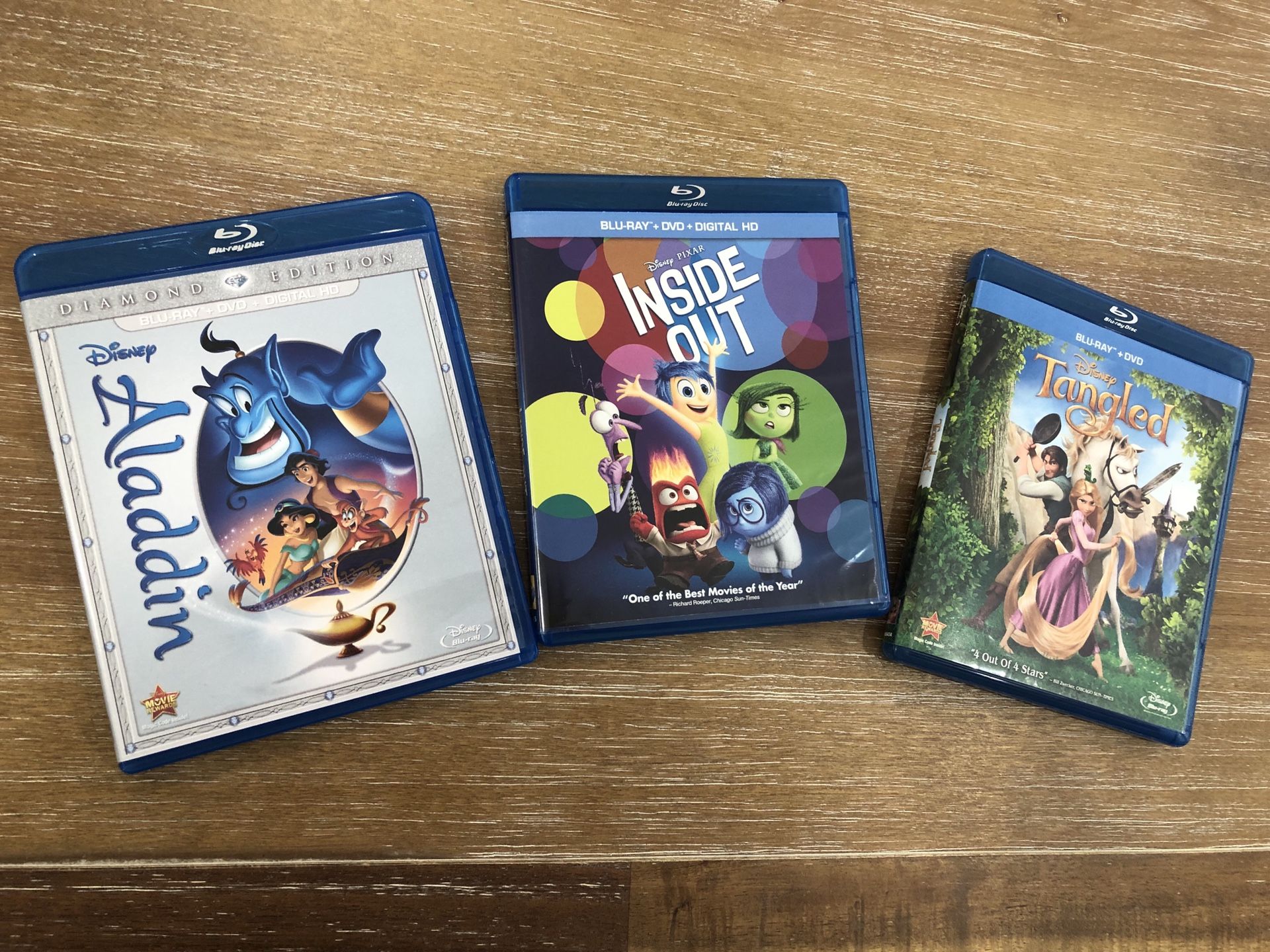 Aladdin, Inside Out and Tangled blue ray dvds