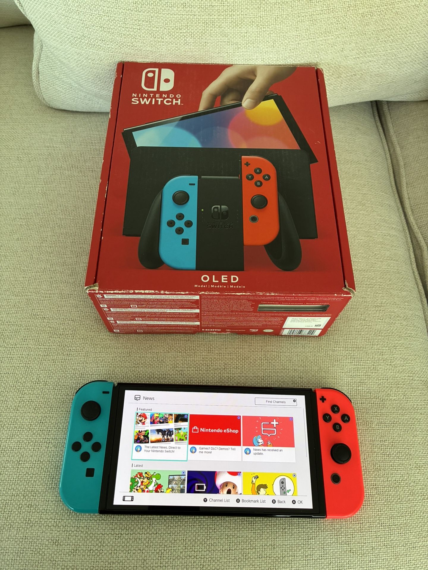 Nintendo Switch OLED System / Console - With Everything Included - Blue / Red Version . System has scratches on screen but works great.  I also have a