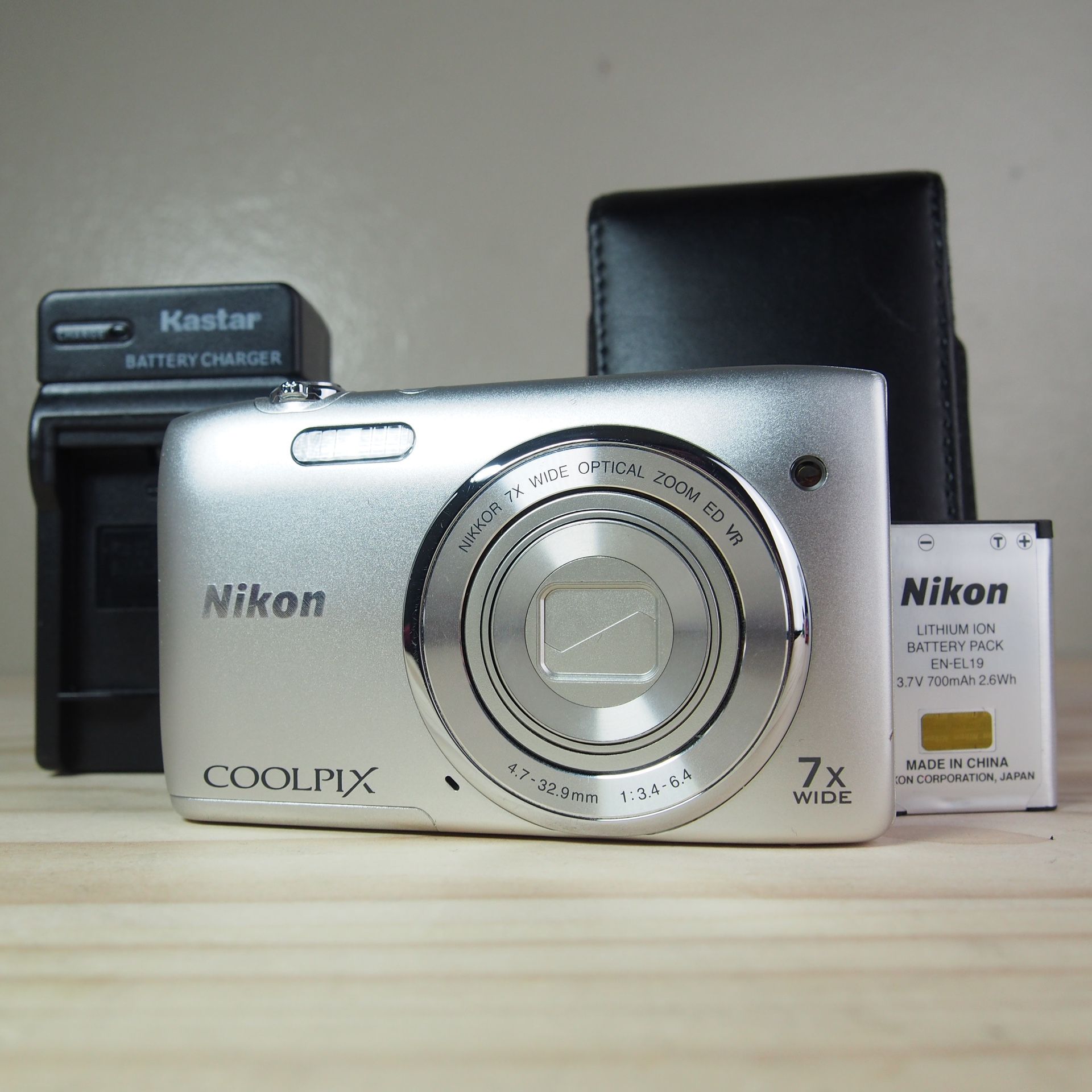 Nikon Coolpix S3500 20.1MP Digital Camera Bundle 7x Wide Zoom Silver Tested EUC Comes with Camera Charger Battery Carrying Case / Protective Case Wris