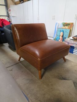 World market lightly used leather chair
